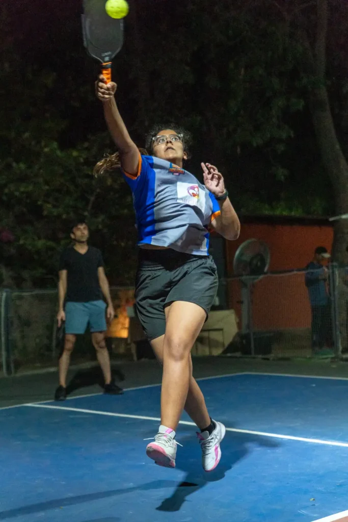 girl playing pickleball